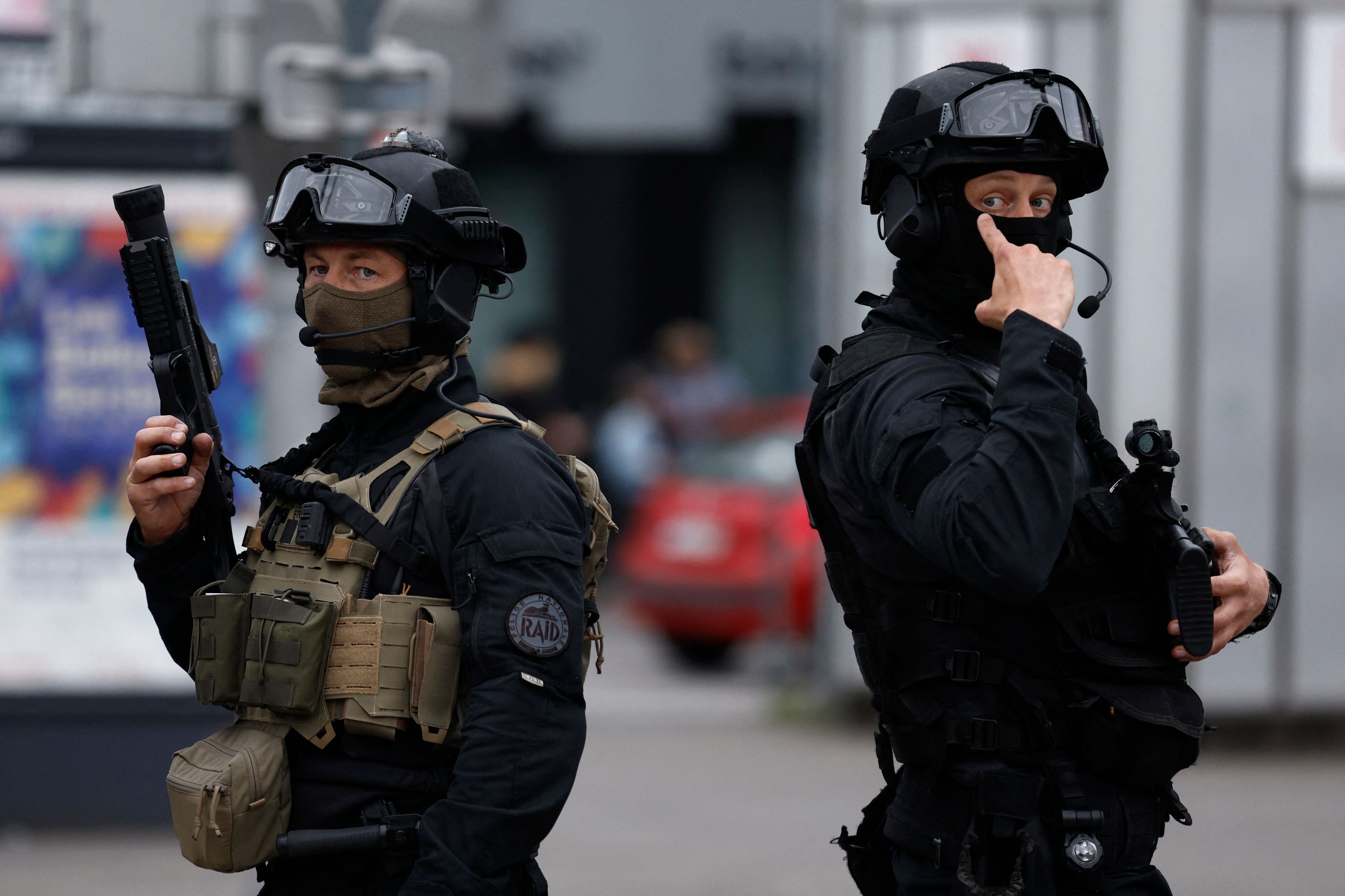 Officers from the RAID ("Research, Assistance, Intervention, Deterrence") tactical unit of the French National Police patrol the street in Lille