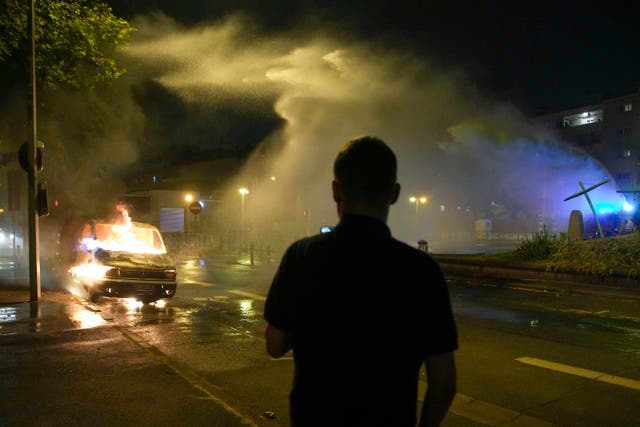 Rioting rages across France for fourth night as family prepare for ...