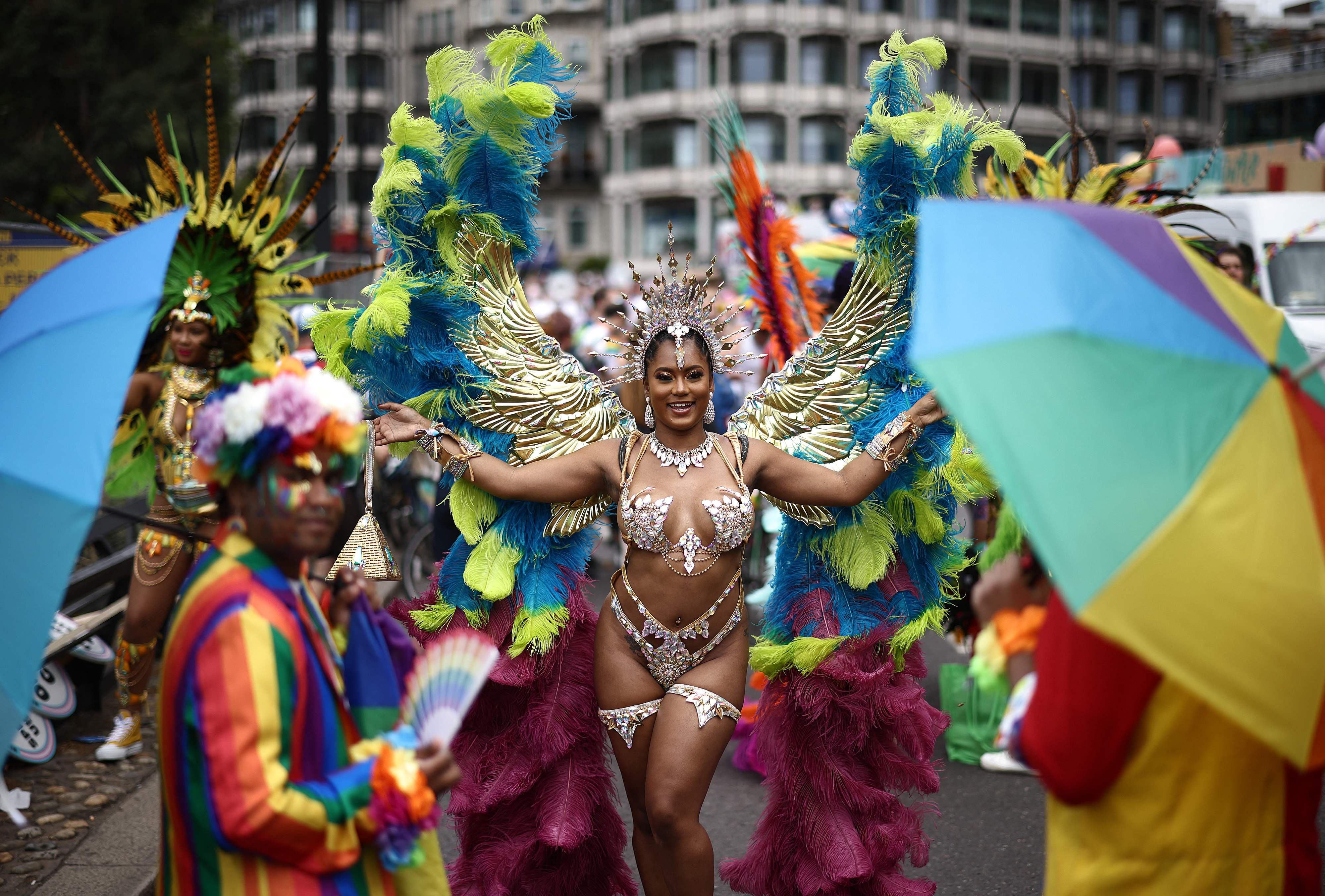 Members of the LGBT+ community take part in the annual Pride Parade in the streets of London
