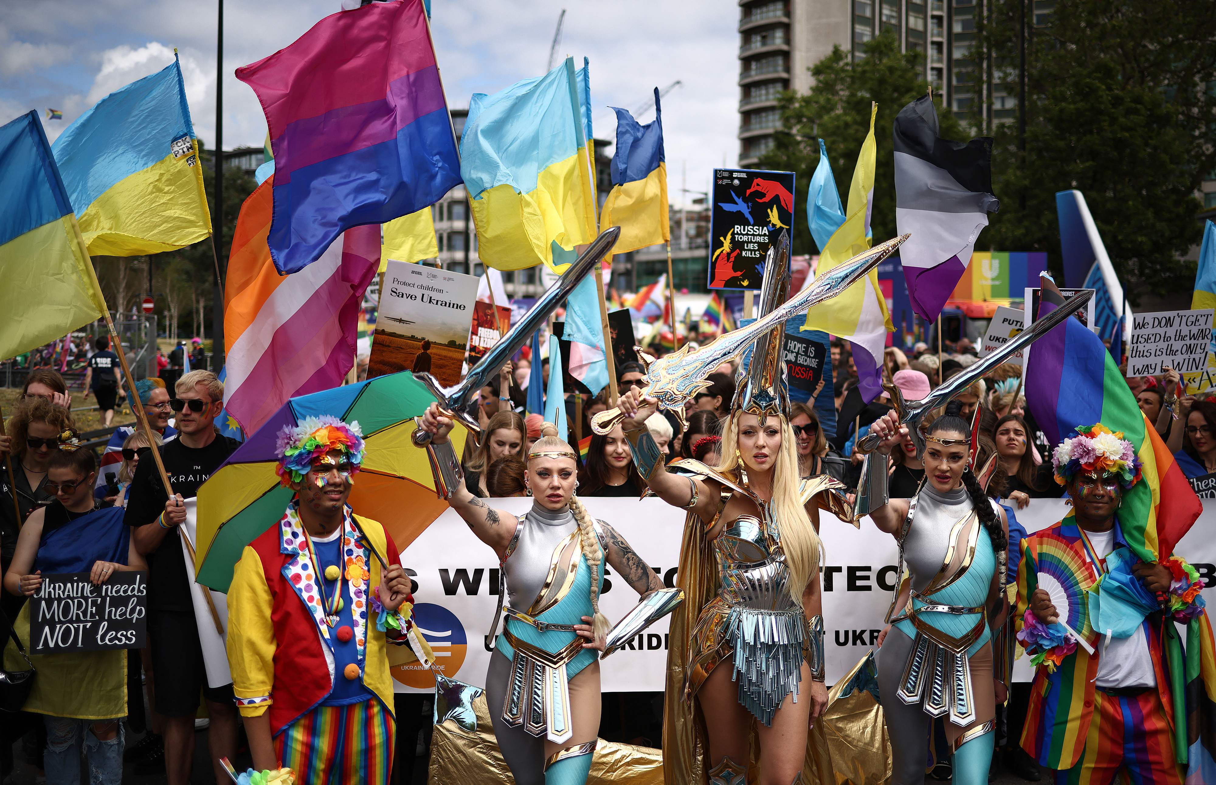 Members of the LGBT+ community take part in the annual Pride Parade in the streets of London