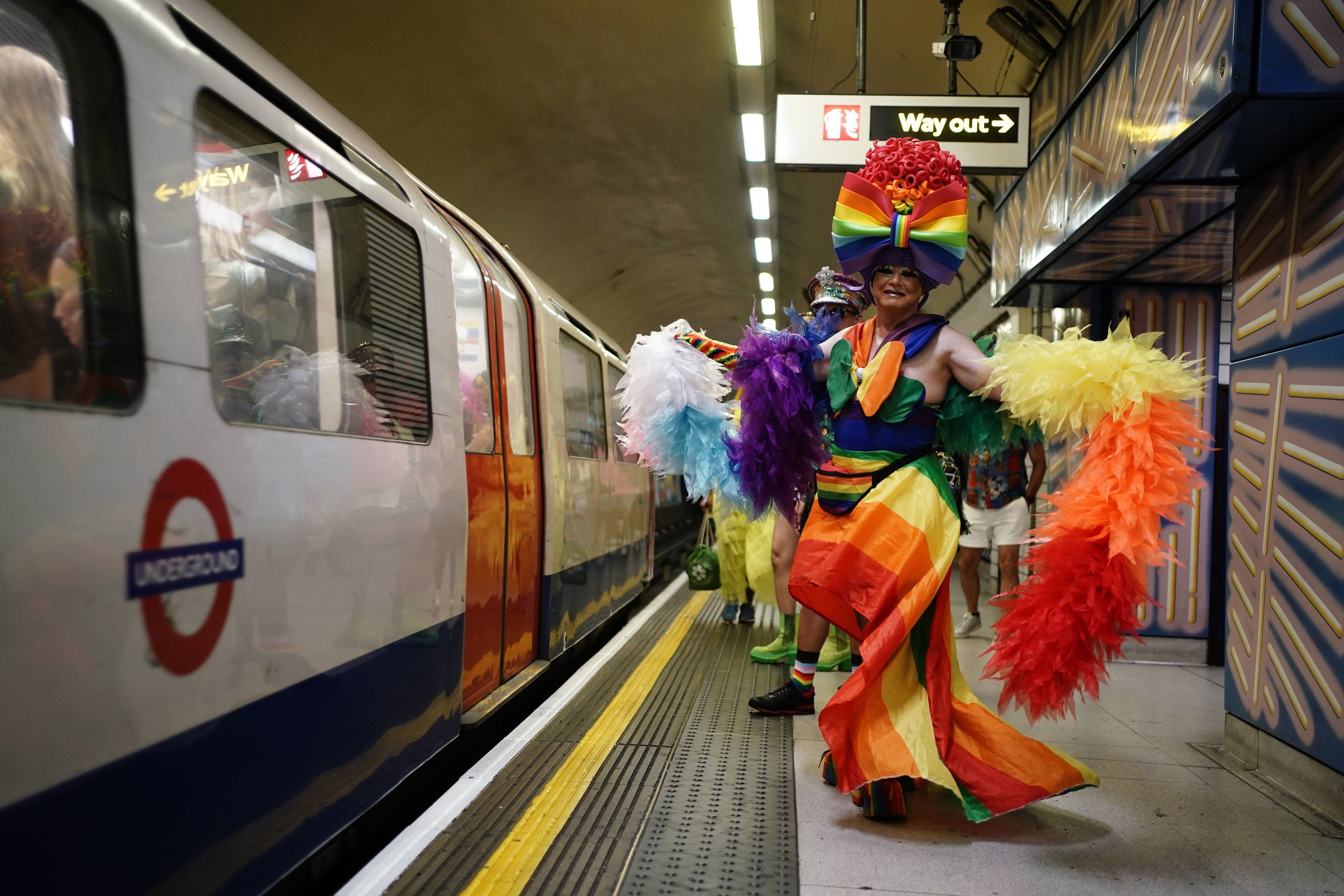 People at Leicester Square underground station as they head to Hyde Park to take part in the Pride in London parade