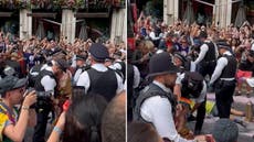 Moment police remove Just Stop Oil protesters from lying in front of Pride float