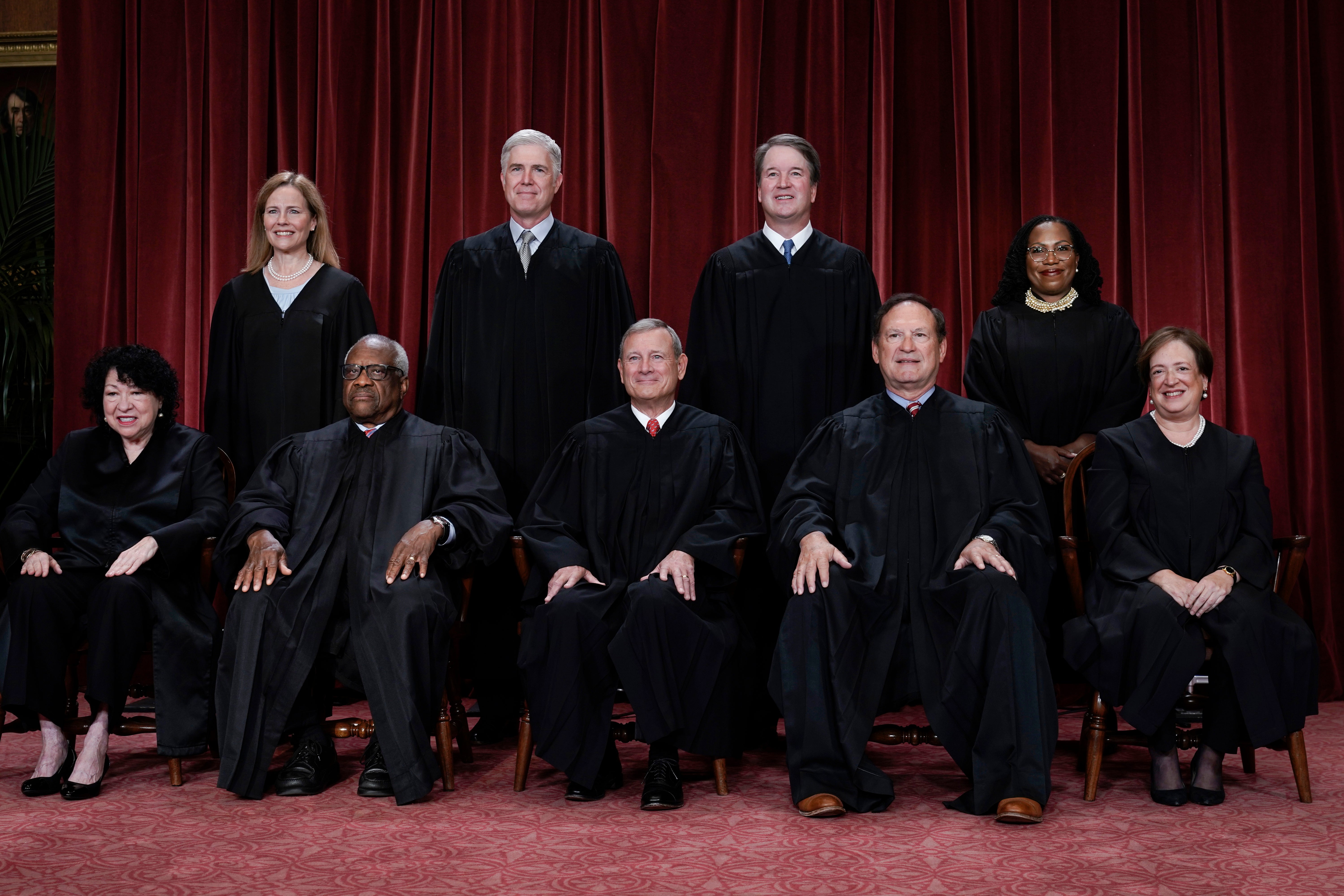Members of the Supreme Court sit for a new group portrait following the addition of Associate Justice Ketanji Brown Jackson, at the Supreme Court building in Washington in October 2022