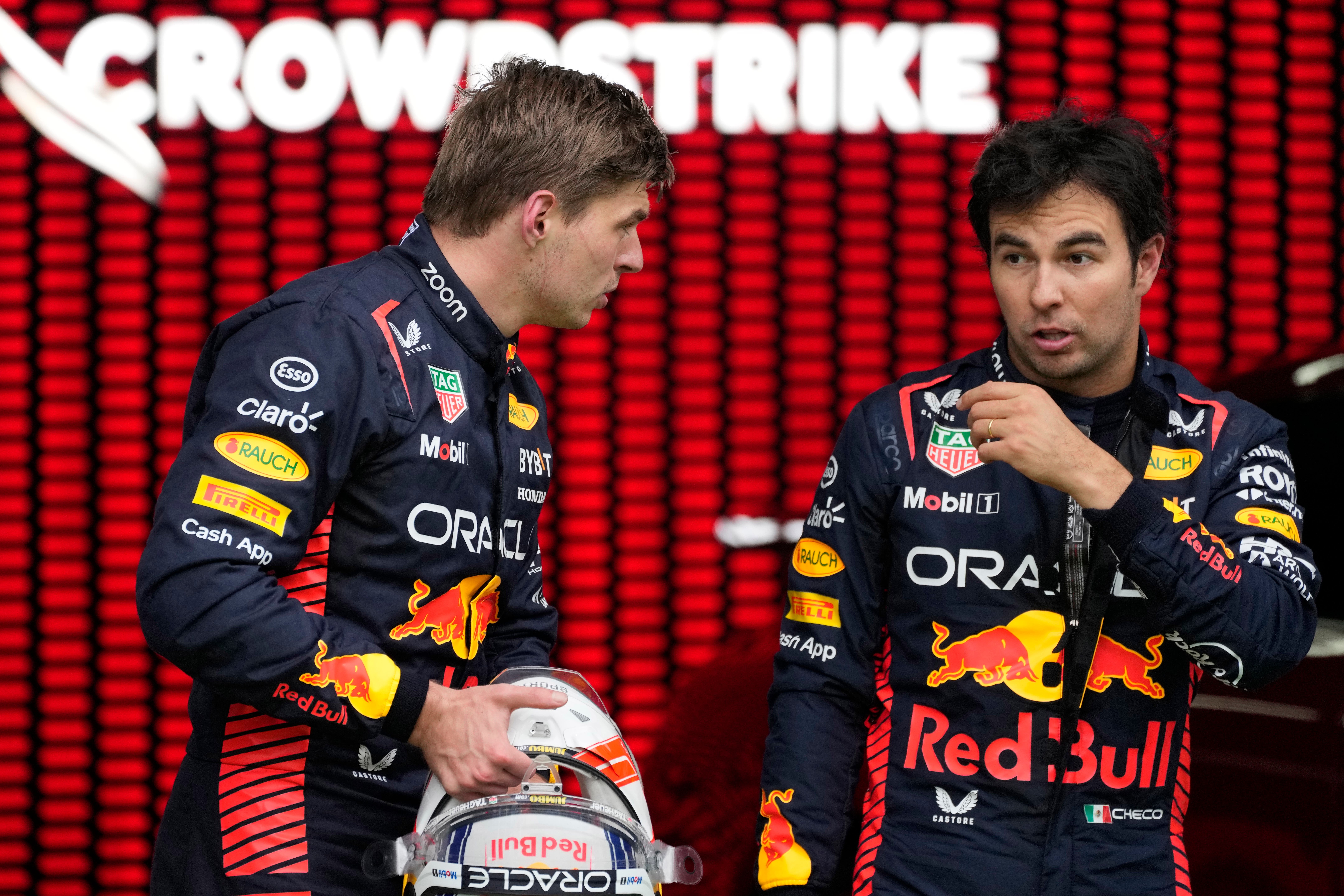 Max Verstappen (left) was critical of the actions of Red Bull team-mate Sergio Perez