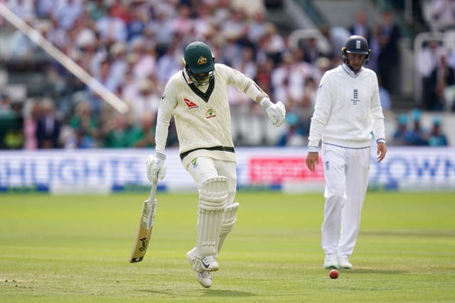 Australia’s Nathan Lyon hobbles on the field (Adam Davy/PA)