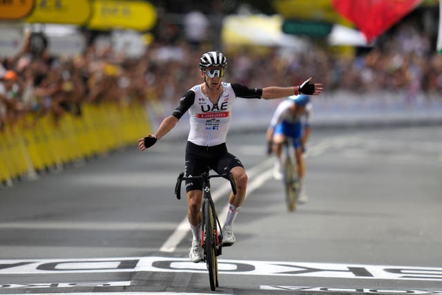 Adam Yates beat twin brother Simon to victory on the opening stage of the Tour de France in Bilbao (Thibault Camus/AP)