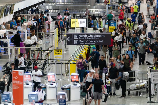 <p>Travelers ahead of the Fourth of July holiday weekend at Hartsfield-Jackson Atlanta International Airport </p>