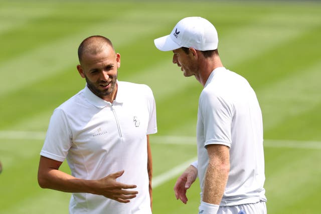 Dan Evans (left) practised with Andy Murray (right) on Centre Court (Steven Paston/PA)