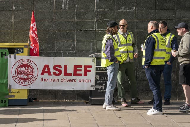 Members of the Aslef union on a picket line near to Leeds railway station (Danny Lawson/PA)