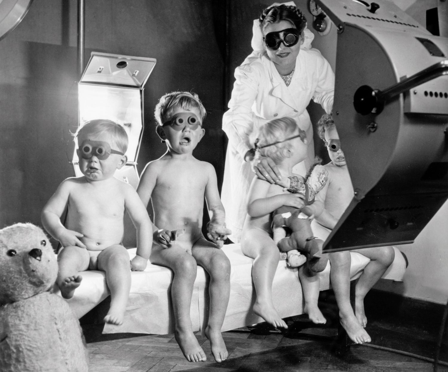 Children receive sun-lamp therapy, believed to have a curative effect on everything from chest infections to acne, in 1948