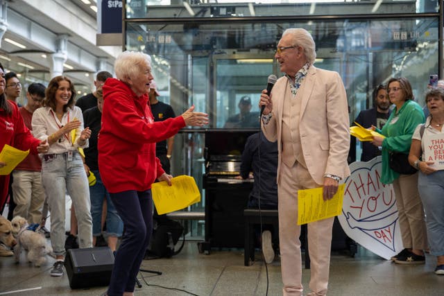 Mary from the Our Dementia Choir and singer Tony Christie at St Pancras for Thank You Day (Sam Lane Photography for Music for Dementia /PA)