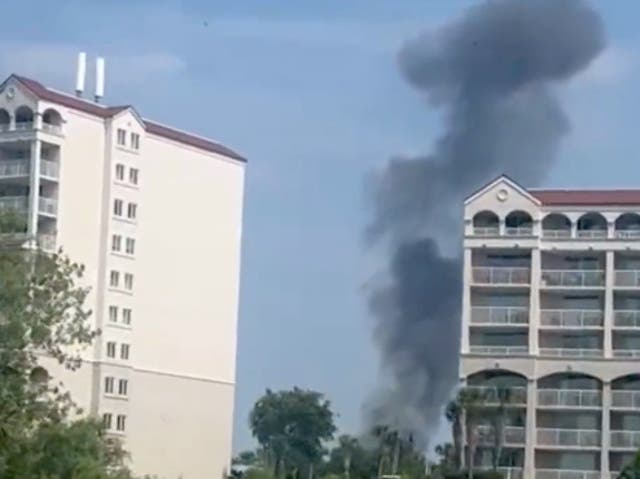 <p>A smoke cloud billowing over North Myrtle Beach, South Carolina, after a single-engine plane carrying four occupants crashed near a golf resort, killing at least one individual</p>