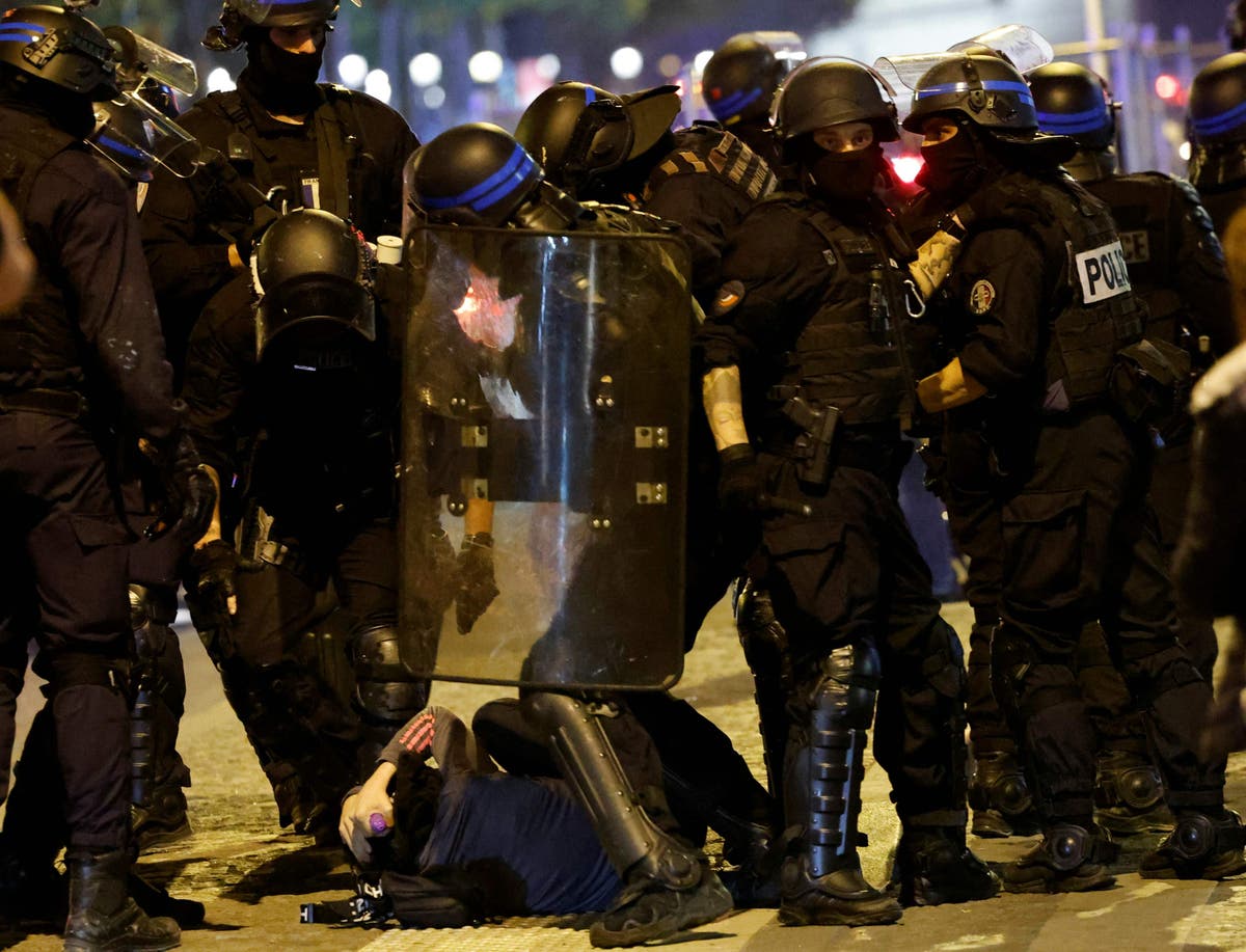 Children as young as 12 detained for attacking police – latest on Paris protests