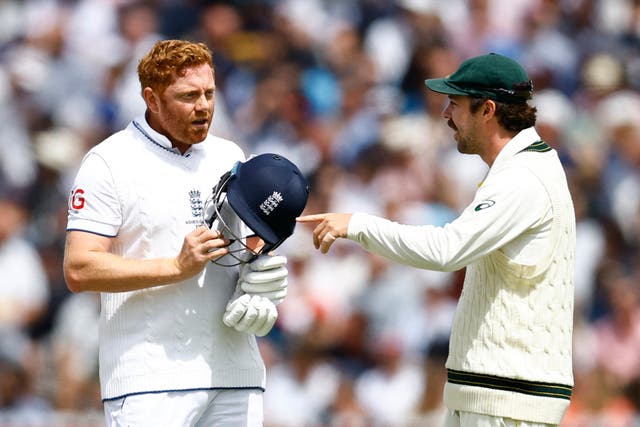<p>Jonny Bairstow discusses the finer points of the incident with Australia’s Travis Head </p>