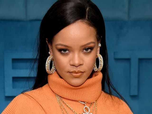 Rihanna Stuns In A Chic Leather Jacket & Bold Red Lipstick As She