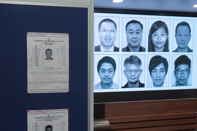 <p>Photos of eight activists for whom arrest warrants have been issued for national security offences are displayed during a press conference in Hong Kong</p>