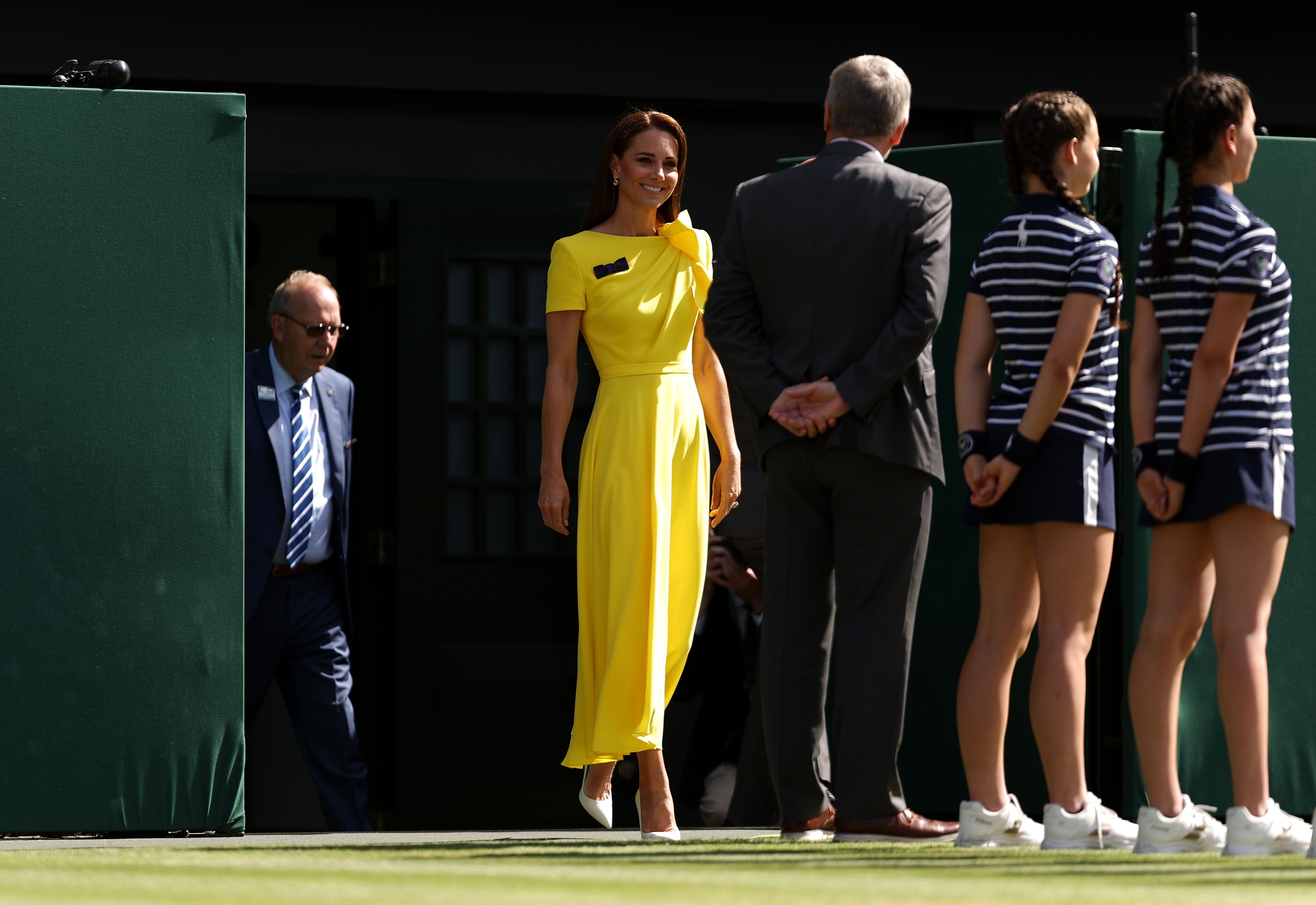 Catherine, The Duchess of Cambridge walks out to present the trophy to Elena Rybakina of Kazakhstan after victory against Ons Jabeur of Tunisia during the Ladies' Singles Final match on day thirteen of The Championships Wimbledon 2022 at All England Lawn Tennis and Croquet Club on July 09, 2022