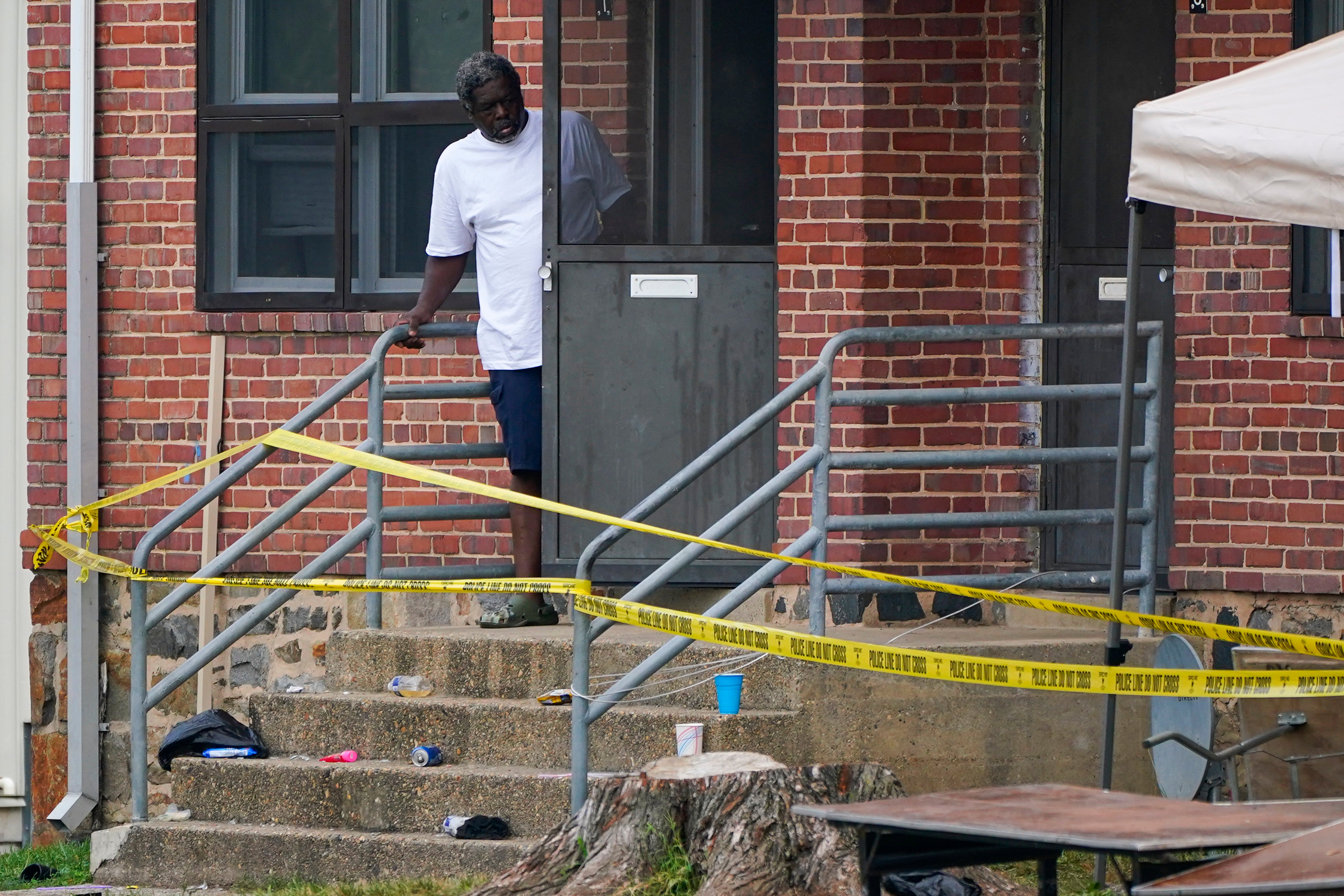 A person looks out at the scene of the mass shooting