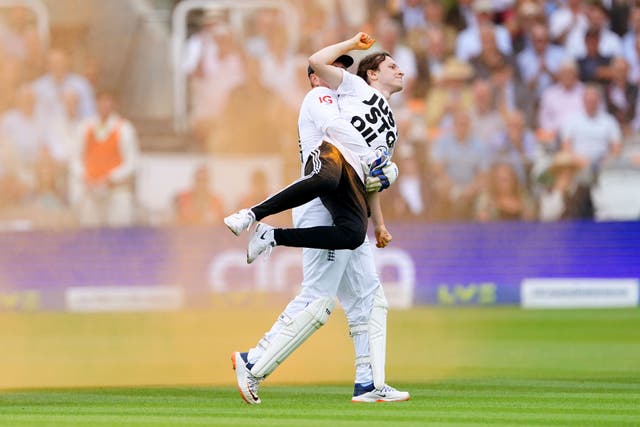 England’s Jonny Bairstow carries a Just Stop Oil protester off the pitch at Lord’s (Mike Egerton/PA).