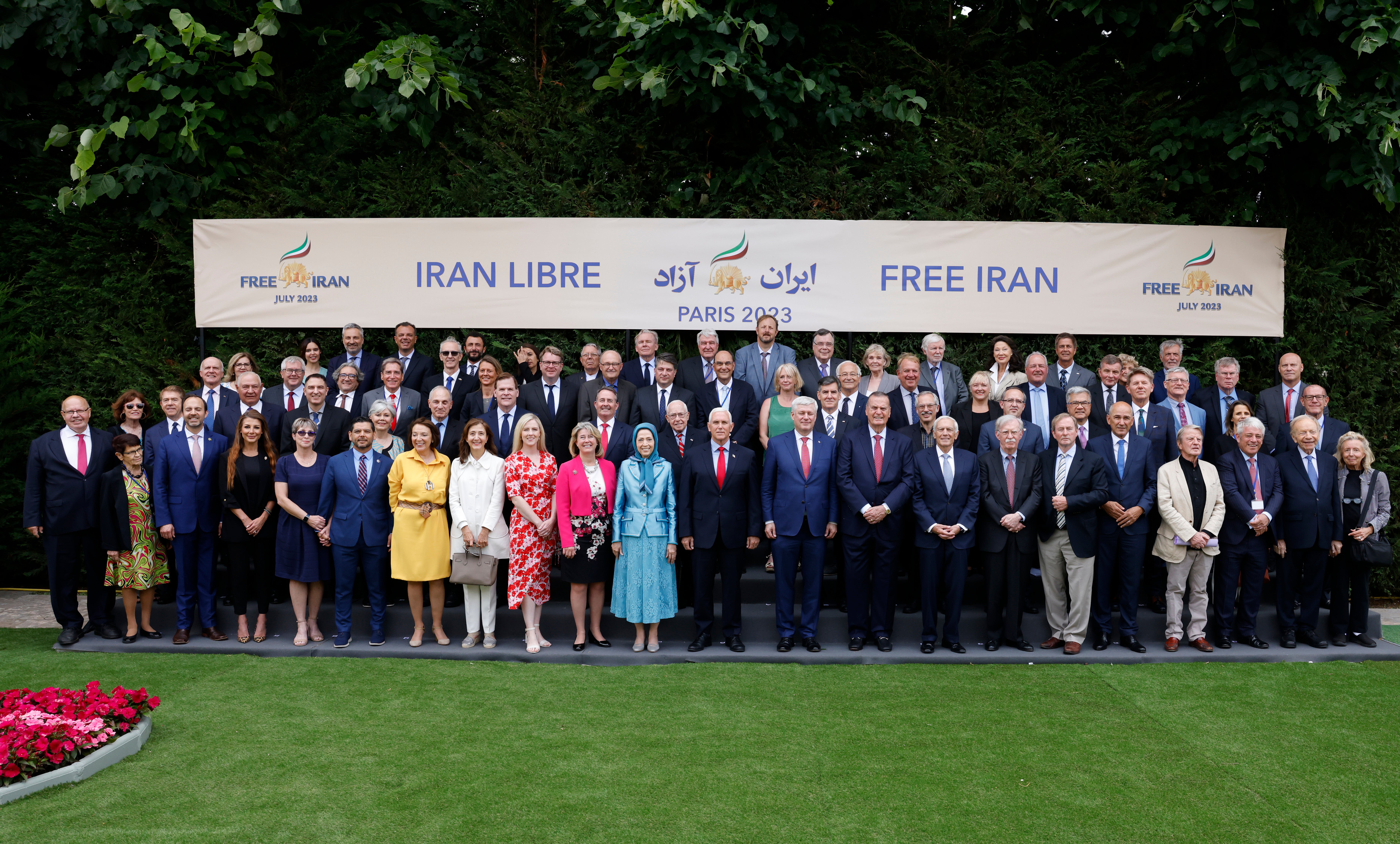 VIPs including Mike Pence, John Bolton and others take a group photograph at the 2023 Free Iran rally hosted by the NCRI