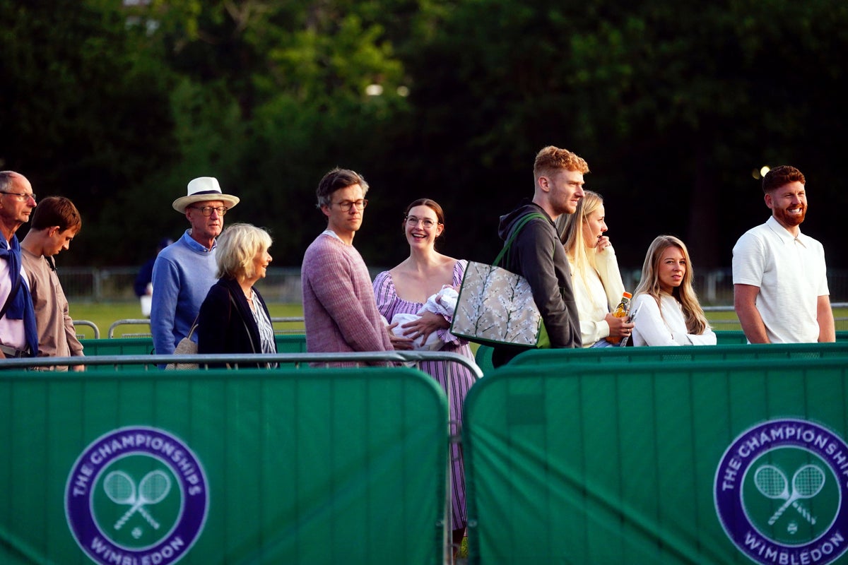 Wimbledon fans may have to battle through rain to watch day two