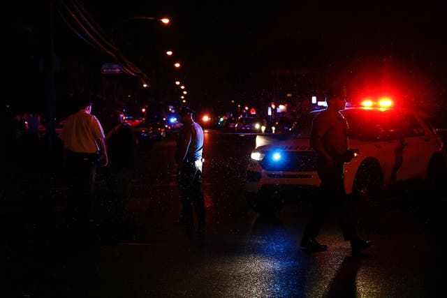 <p>Philadelphia police stand at the intersection of 56th Street and Kingsessing Avenue after multiple people were shot in Southwest Philadelphia, late Monday, 3 July 2023</p>