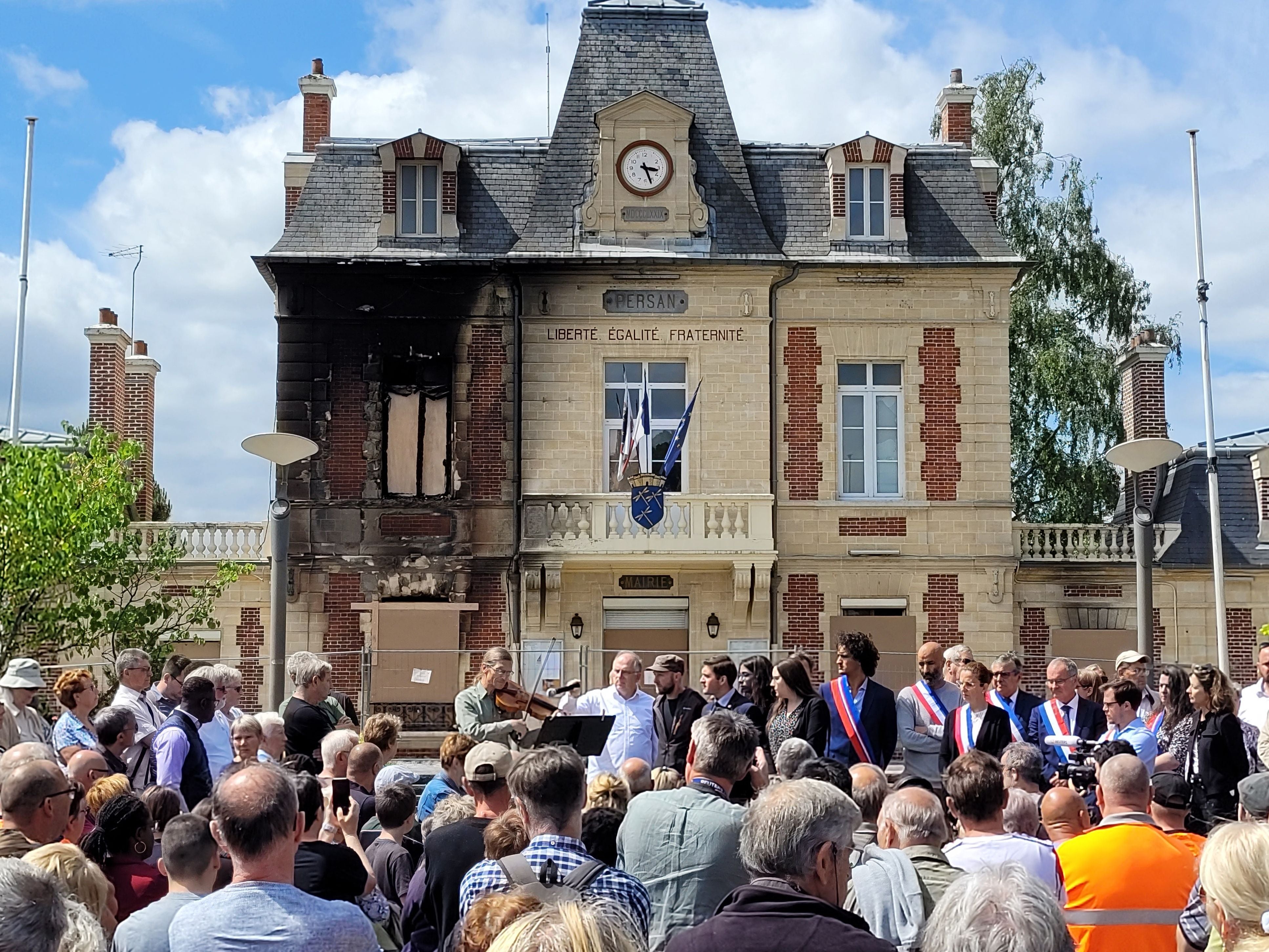 Local residents and representatives gather in front of the city hall during a nationwide action in Persan, on the outskirts of Paris, on 3 July 2023