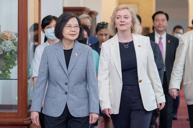 <p>Former British prime minister Liz Truss (R) walking with Taiwan’s president Tsai Ing-wen during a meeting in Taipei</p>
