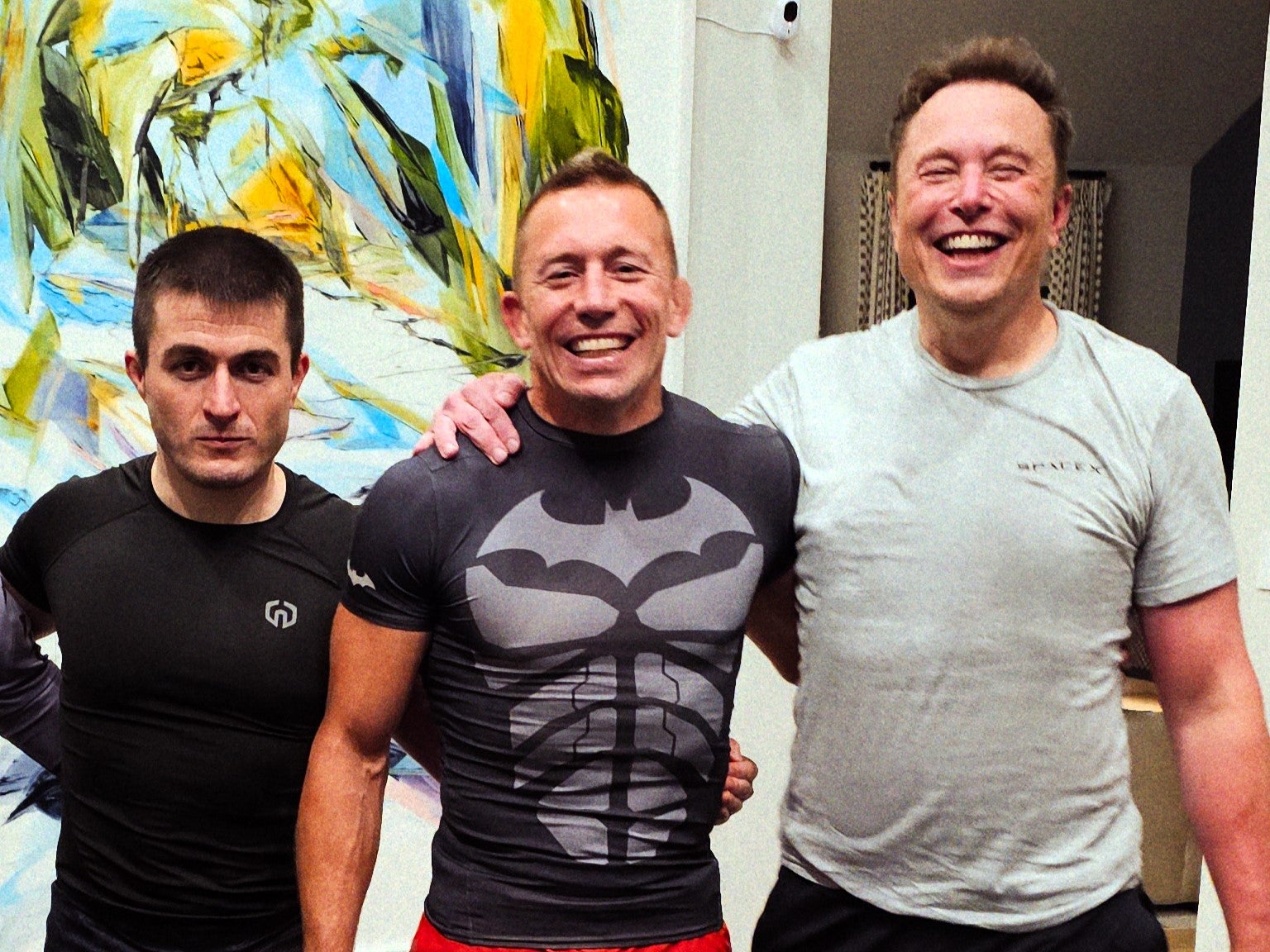 Elon Musk (R) with podcast host Lex Fridman (L) and former UFC champion Georges St-Pierre