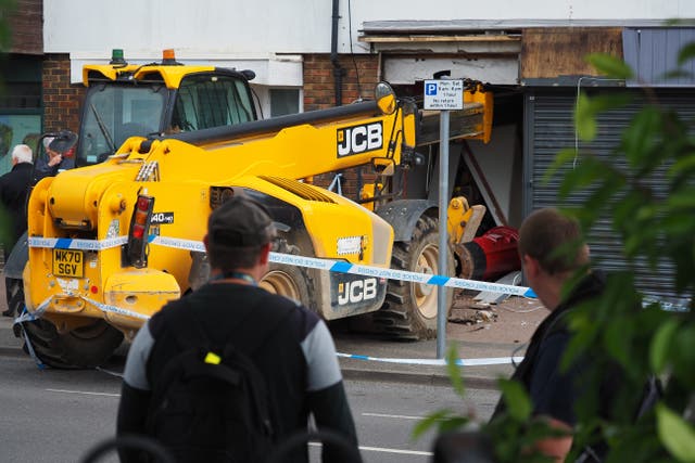 A man has been arrested after a crane was used in an attempt to steal a cash machine from a supermarket (Joe Sene/PA)