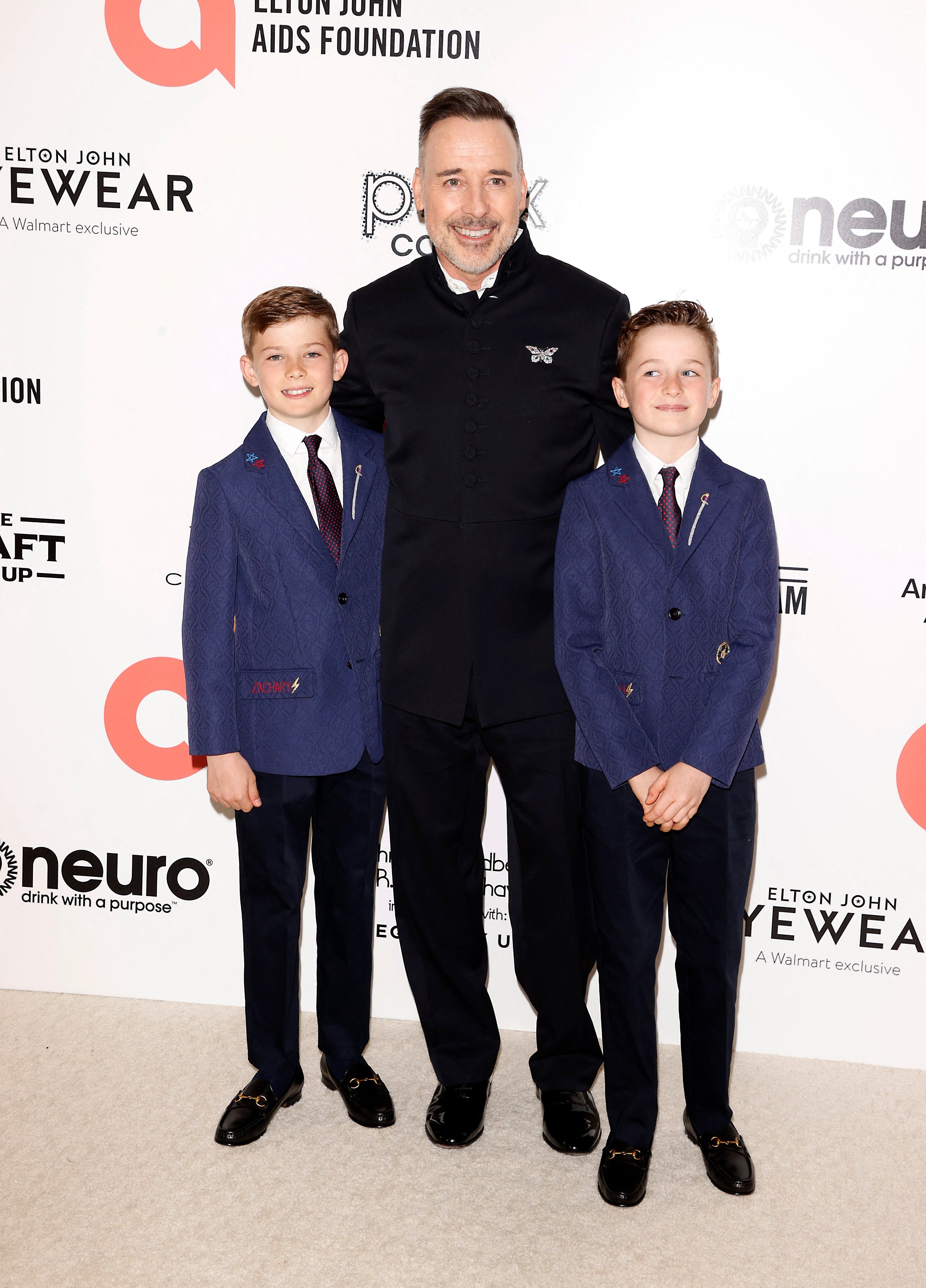 Furnish with his and Elton’s sons Elijah (left) and Zachary in 2022