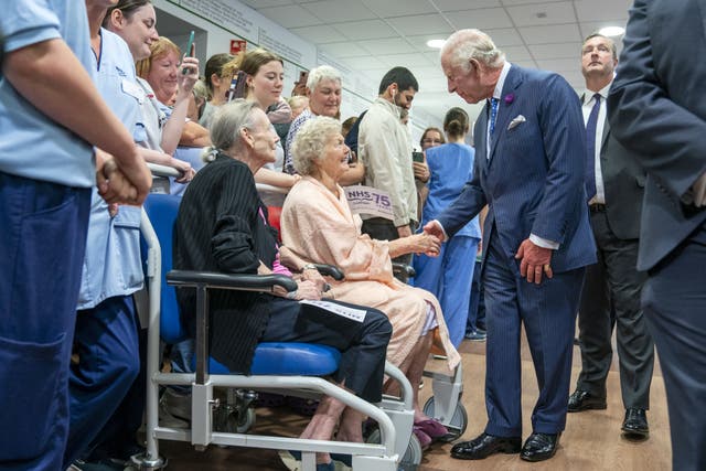 King Charles and Queen Camilla meet staff and patients during a visit to the Royal Infirmary of Edinburgh, to celebrate 75 years of the NHS (Jane Barlow/PA)