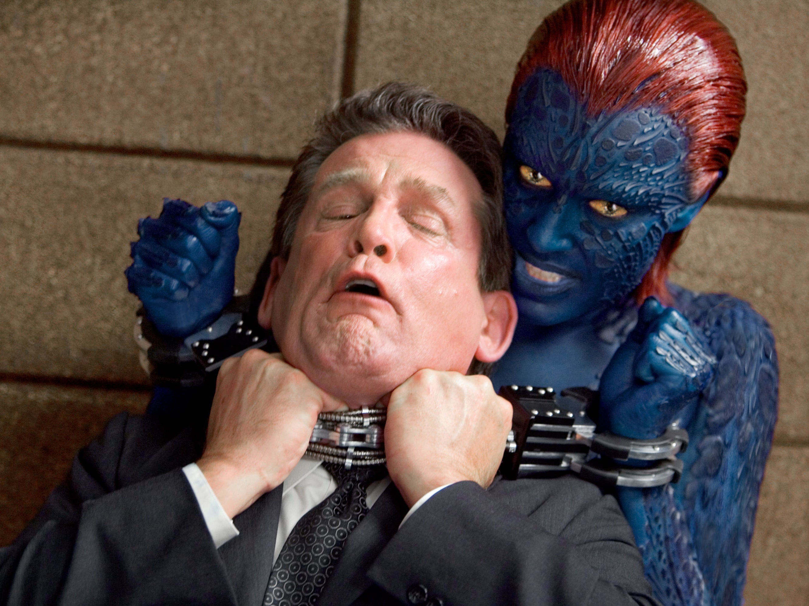 Blue lady: Romijn’s Mystique strangles actor Anthony Heald in ‘X-Men: The Last Stand’