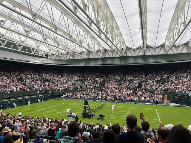 <p>Carlos Alcaraz celebrates after beating Jeremy Chardy at Wimbledon</p>