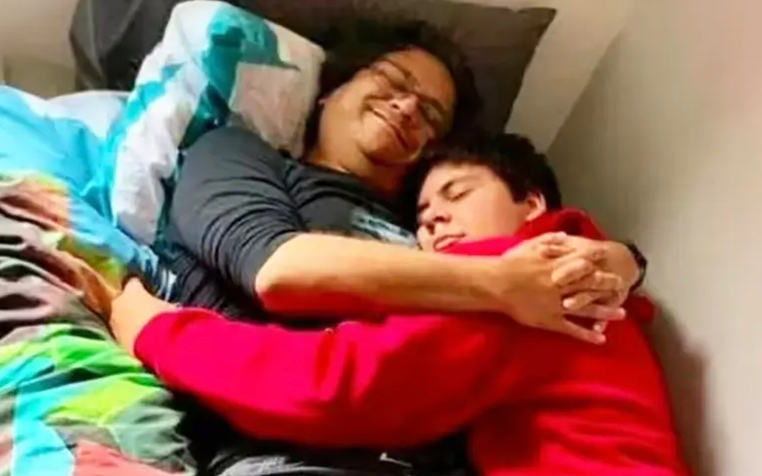 Shahzada Dawood, 48, and 19-year-old son Suleman share a tender hug before their doomed deep sea trip on the Titan submersible