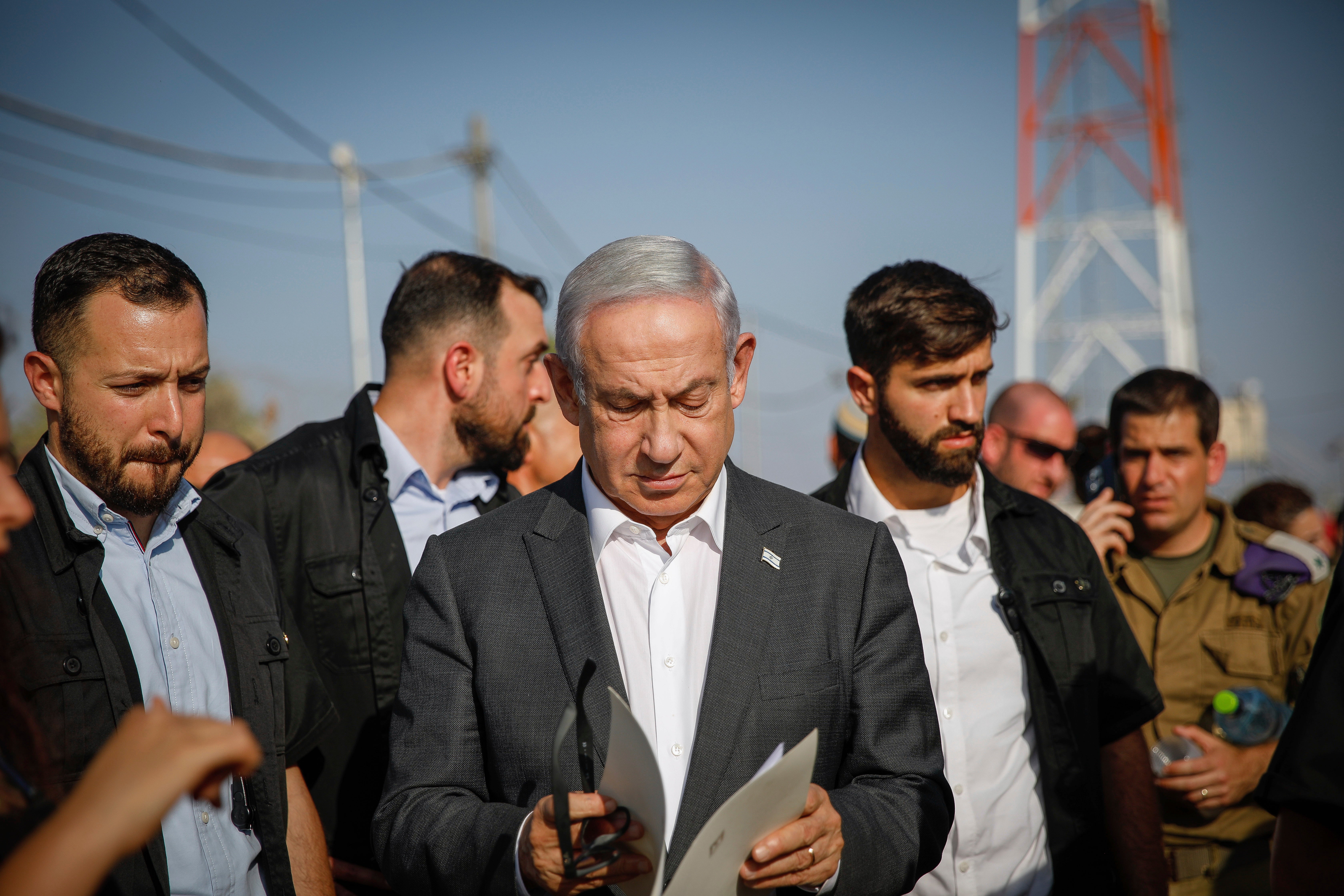 Israeli Prime Minister Benjamin Netanyahu arrives for a briefing near the Salem military post between Israel and the West Bank on Tuesday