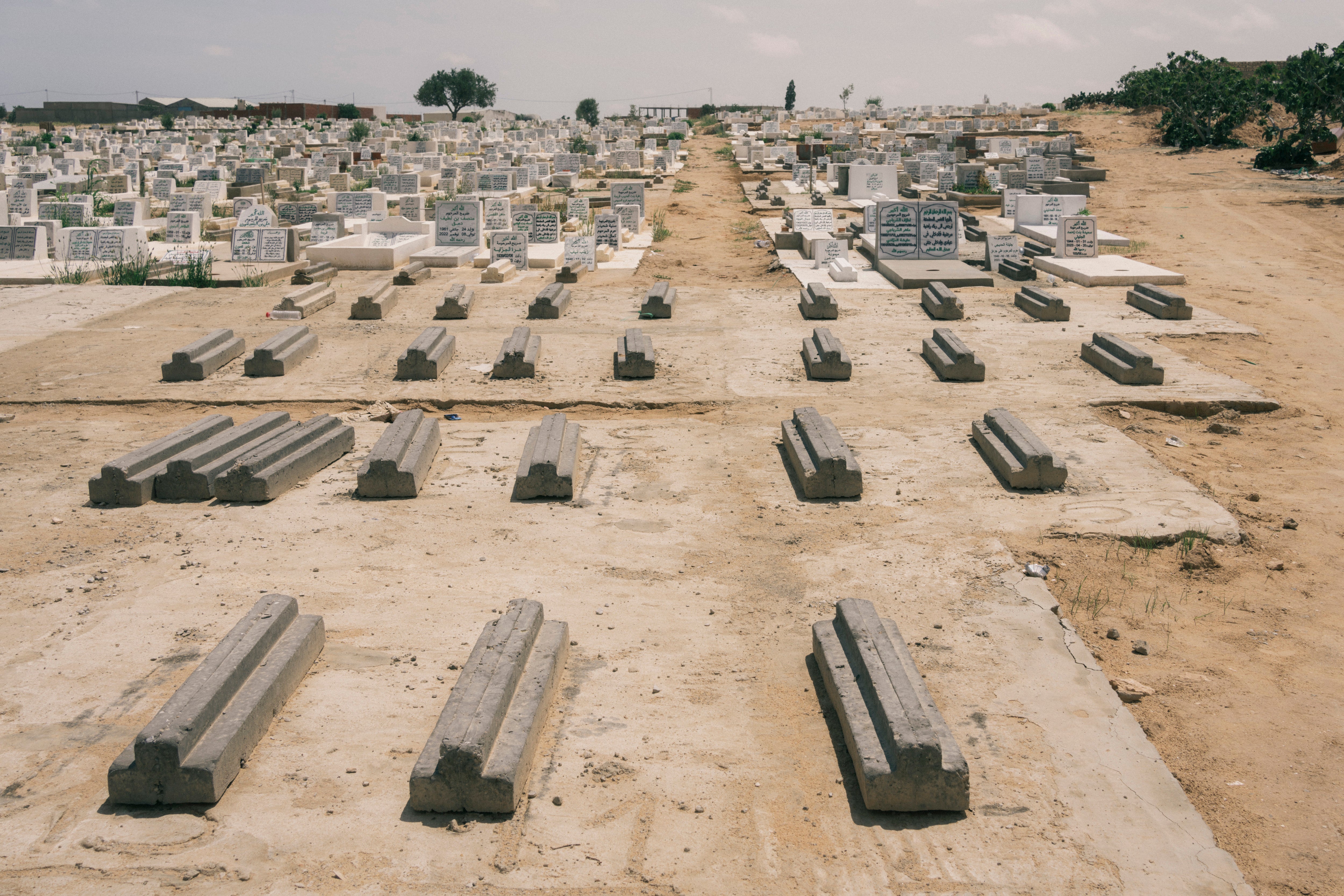 Graves of migrants who died at sea remain unmarked in a cemetery near Sfax in Tunisia