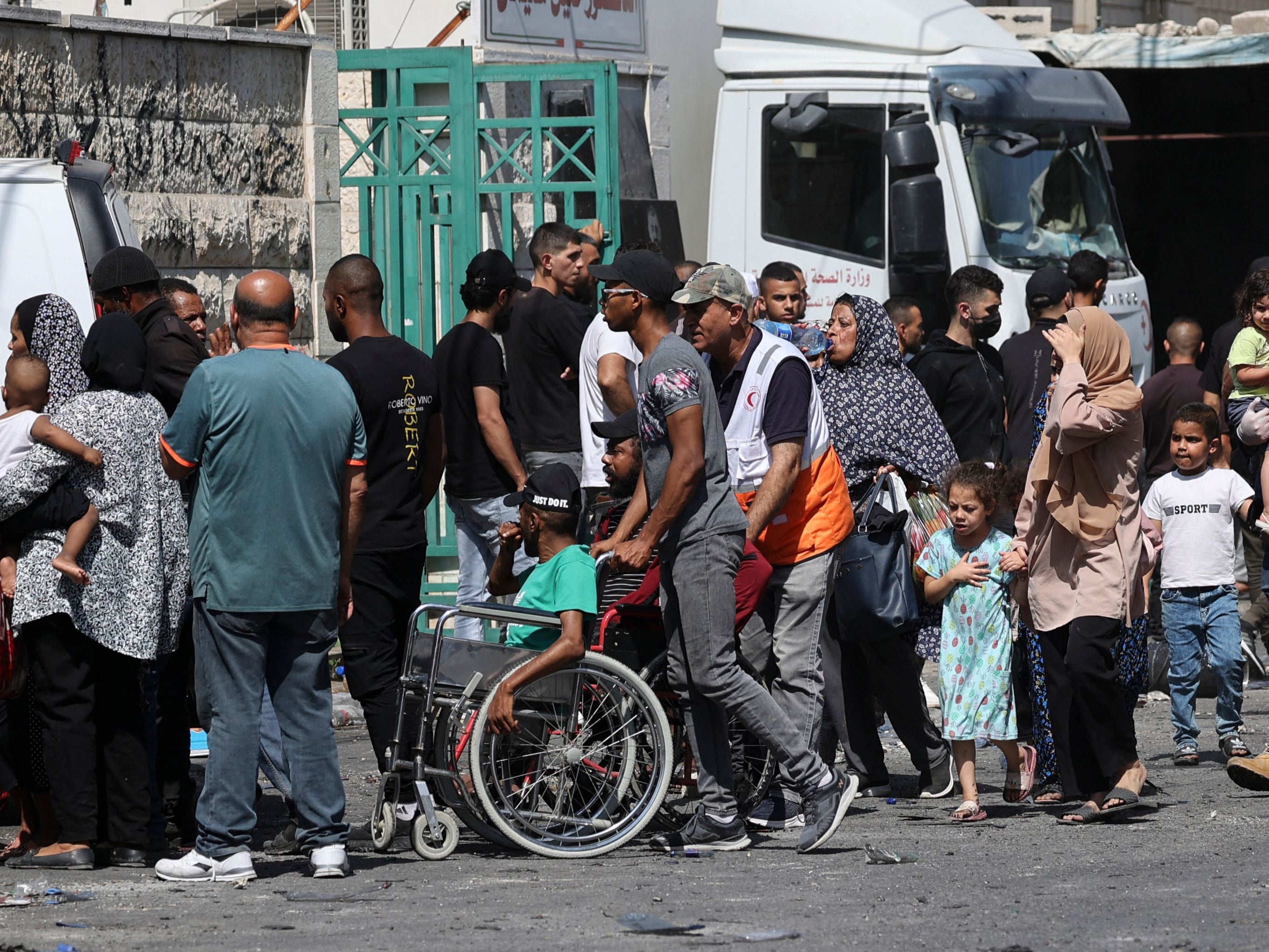 Families leave the Jenin refugee camp on Tuesday