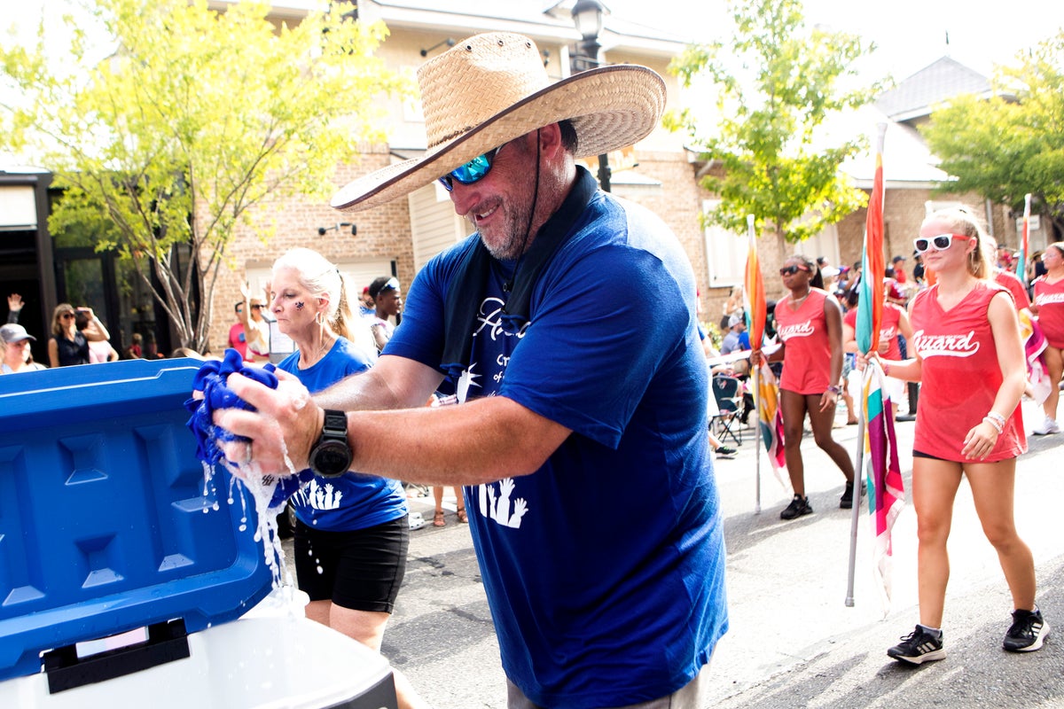 Revelers across the US brave heat and heavy downpours to celebrate ...
