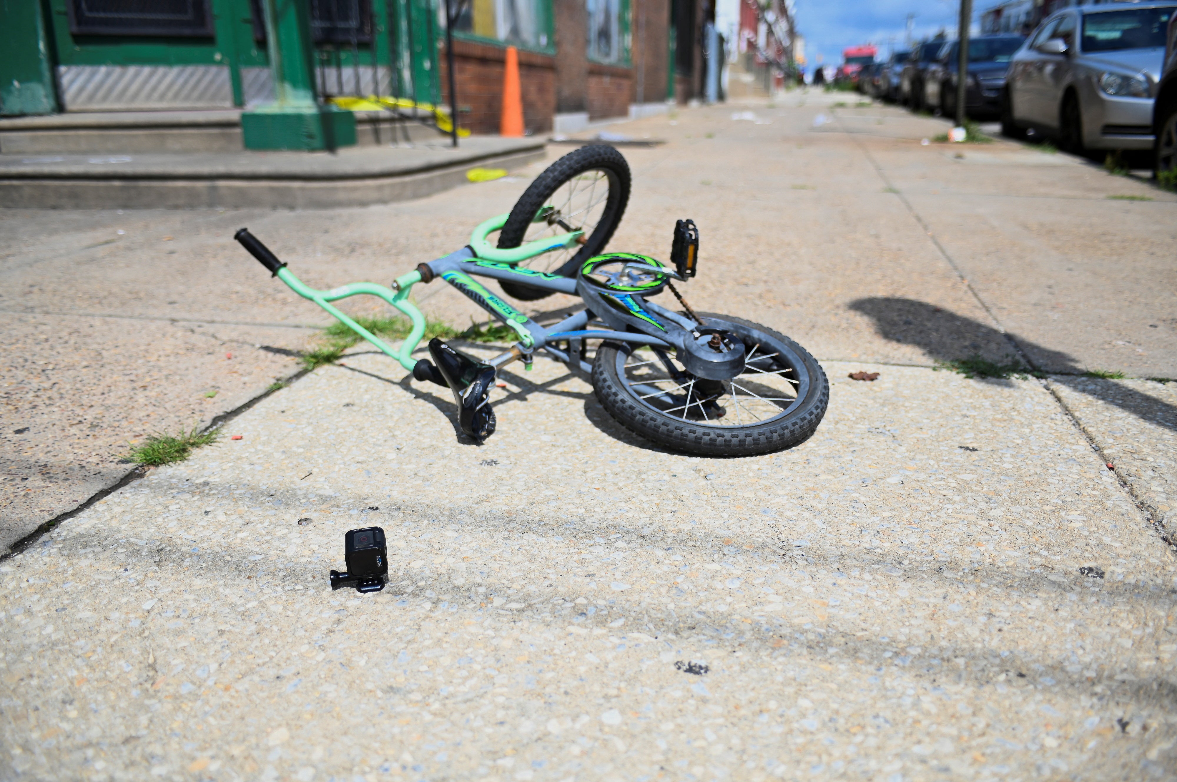 A bicycle is pictured at the scene as investigations are ongoing the day after a mass shooting in the Kingsessing section of southwest Philadelphia, Pennsylvania
