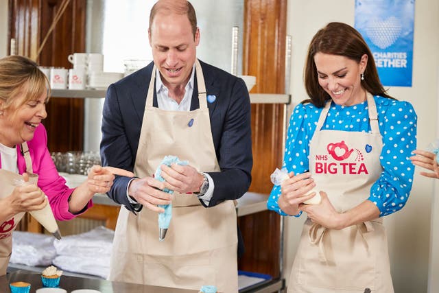 <p>William and Kate added the final touches to cupcakes with presenter Mel Giedroyc (Kensington Palace hand-out)</p>