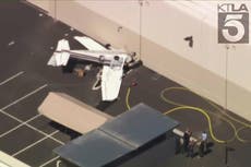 Report says plane rolled upside down in crash near California airport, killing father, injuring sons