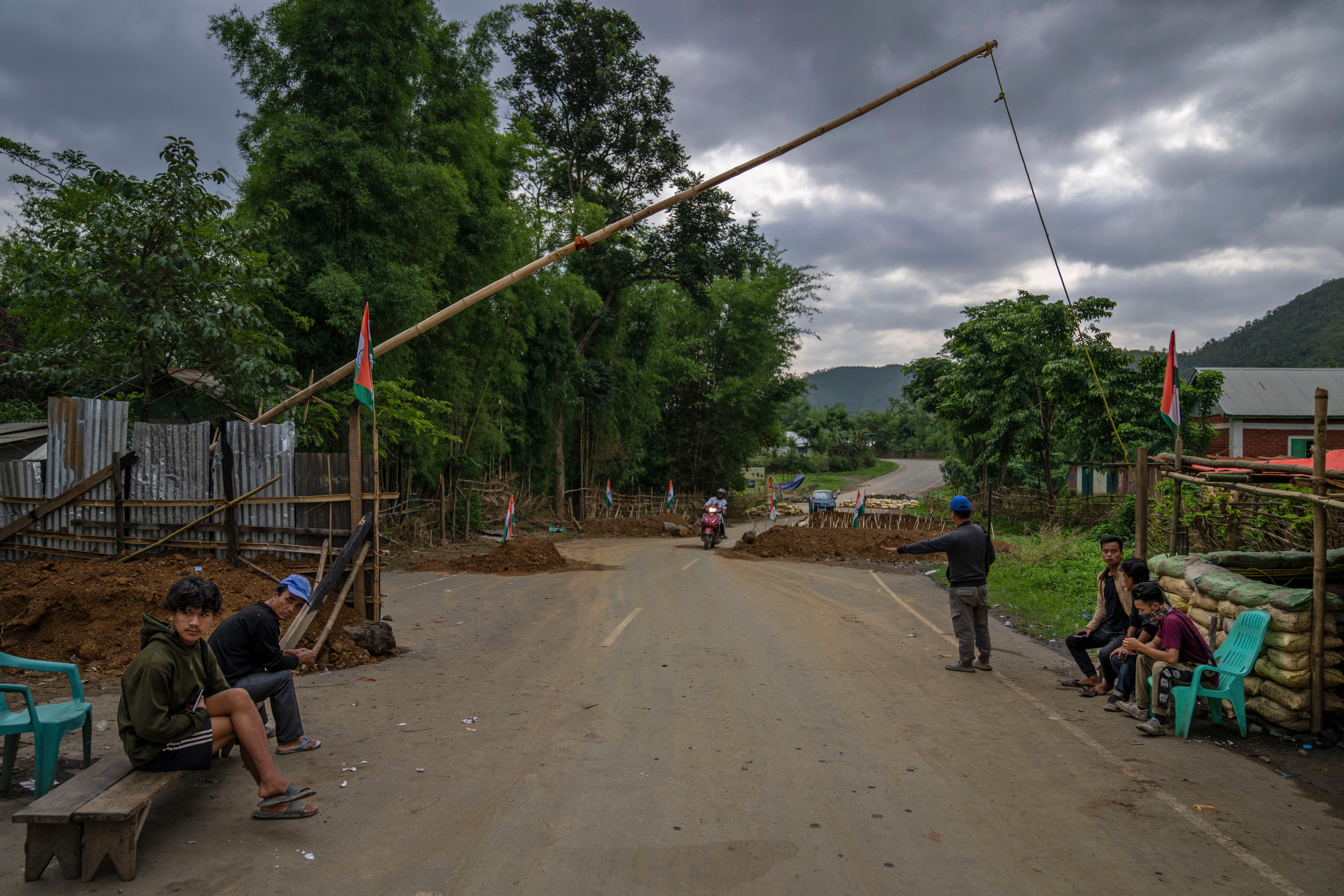 Tribal Kuki community volunteers man a checkpoint between two ethnic zones in Churachandpur, in Manipur state, in June.