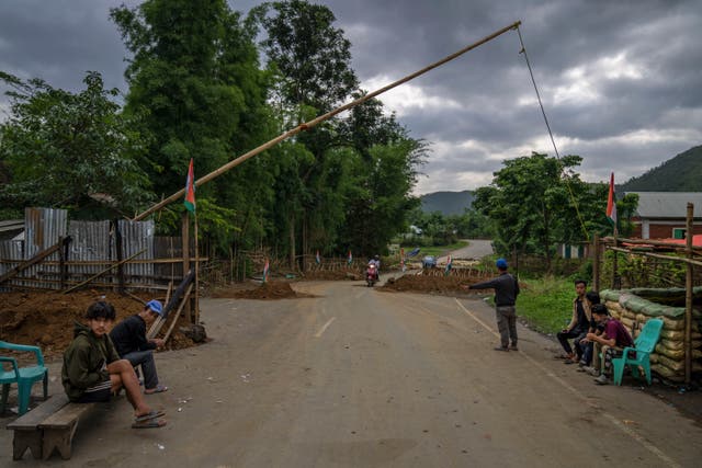 <p>Tribal Kuki community volunteers man a checkpoint between two ethnic zones in Churachandpur, in Manipur state, in June. </p>