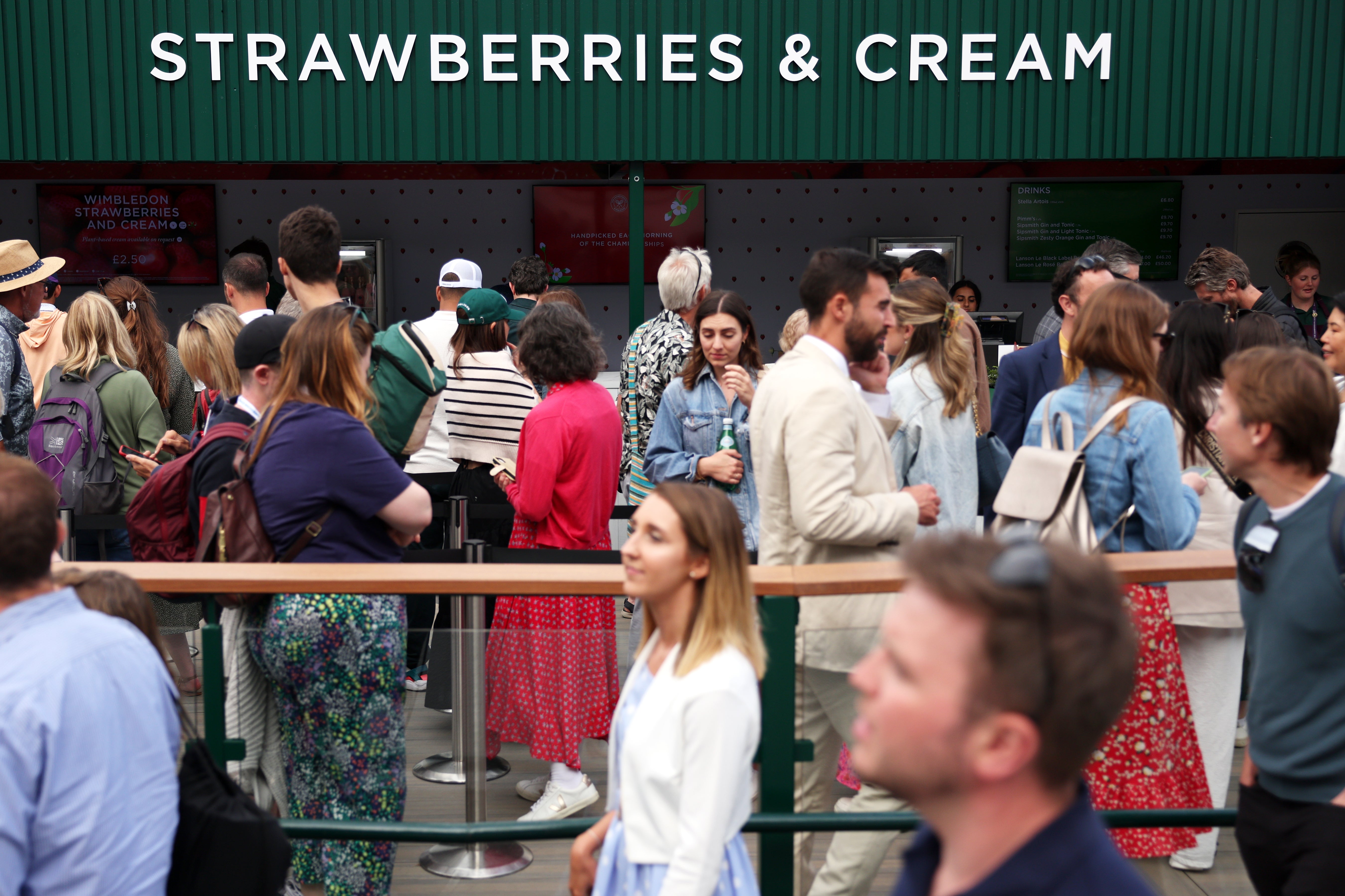 The queue for strawberries and cream, whose price has been frozen for a 13th year