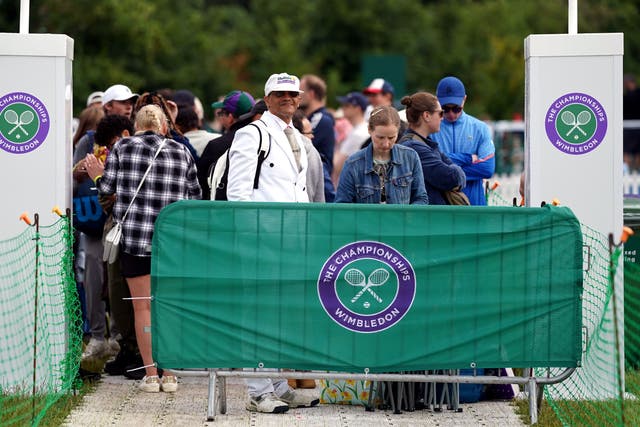 Tennis fans in the queue on day three of Wimbledon (Adam Davy/PA)