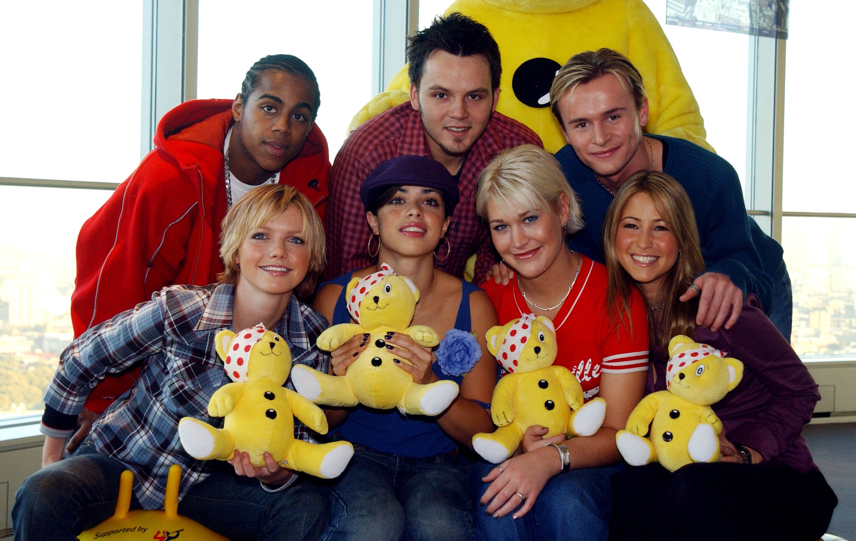 Spearritt (front left) with S Club 7 in 2001