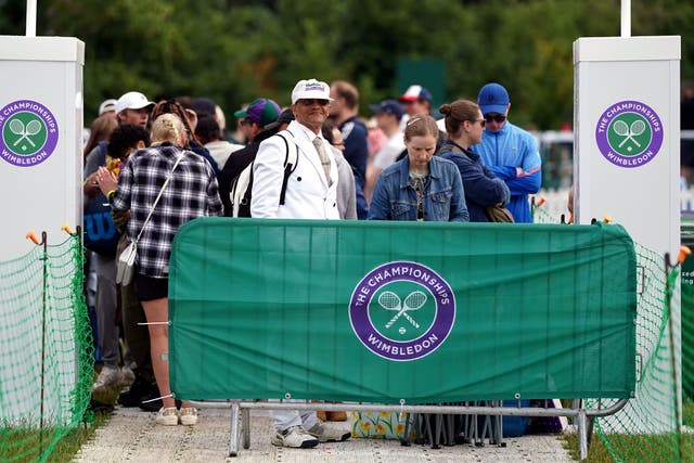 <p>Tennis fans joined the queue for matches on day three of Wimbledon (Adam Davy/PA)</p>