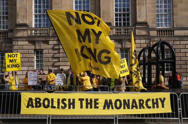 <p>Protesters holding sings titled ‘Not my King’ </p>