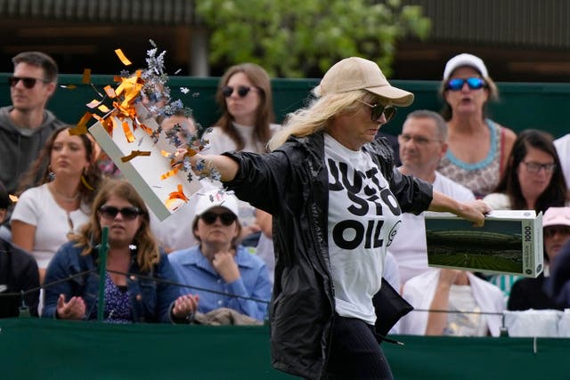 A Just Stop Oil protester runs on to Court 18 (Alastair Grant/AP)